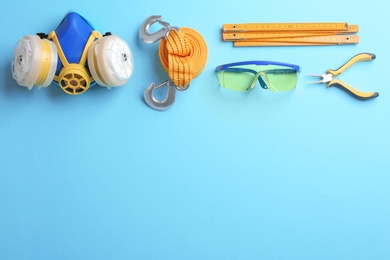 Photo of Flat lay composition with construction tools on color background, space for text