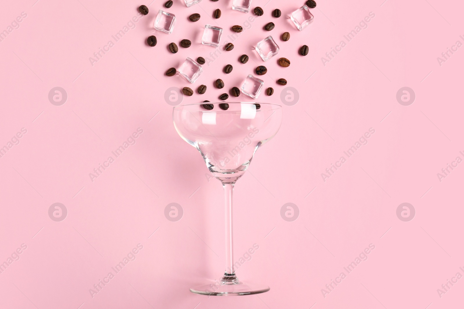 Photo of Flat lay composition with glass, coffee beans and ice cubes on color background. Alcohol cocktail recipe - Espresso Martini