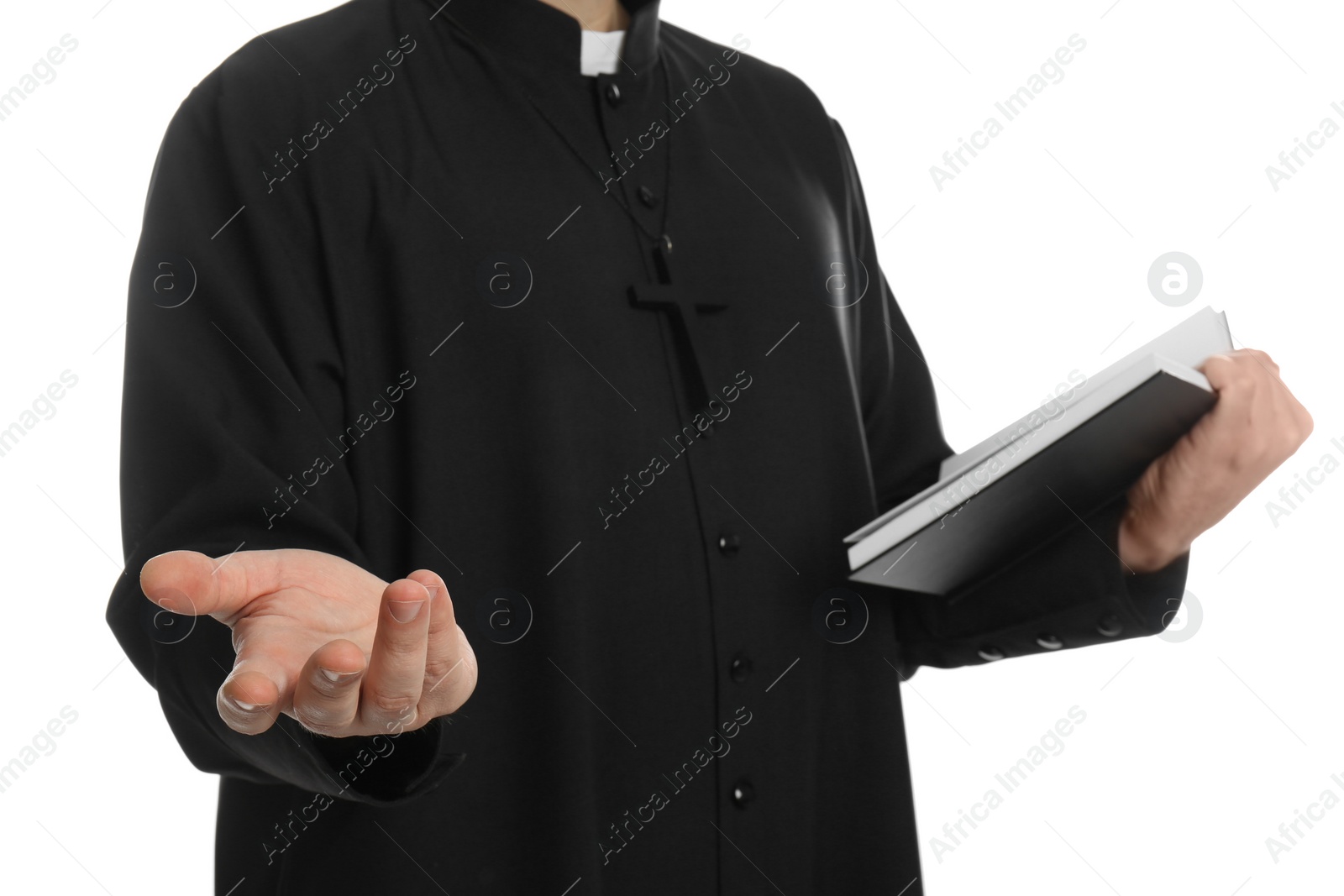 Photo of Priest with Bible praying on white background, closeup