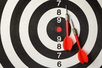 Red arrows on dart board, top view