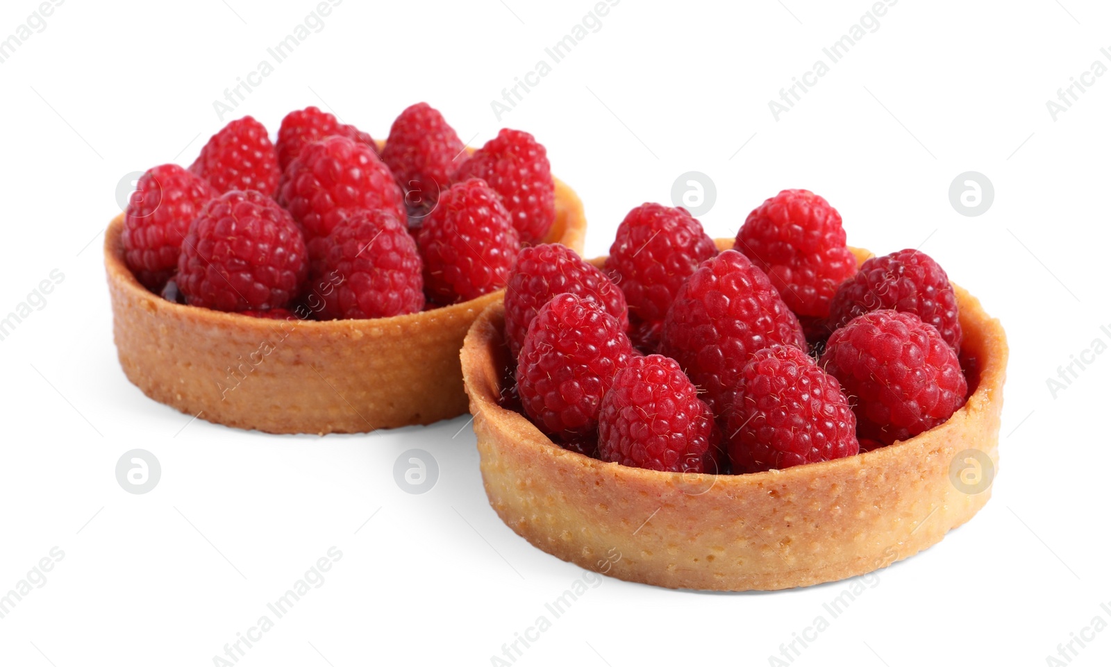 Photo of Tartlets with fresh raspberries isolated on white. Delicious dessert