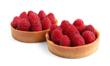 Photo of Tartlets with fresh raspberries isolated on white. Delicious dessert