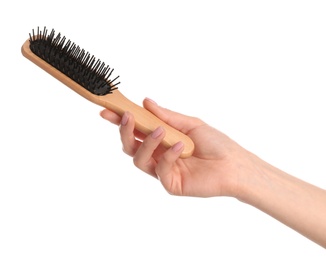 Photo of Woman holding wooden hair brush against white background, closeup