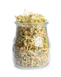 Photo of Glass jar of sprouted green buckwheat isolated on white