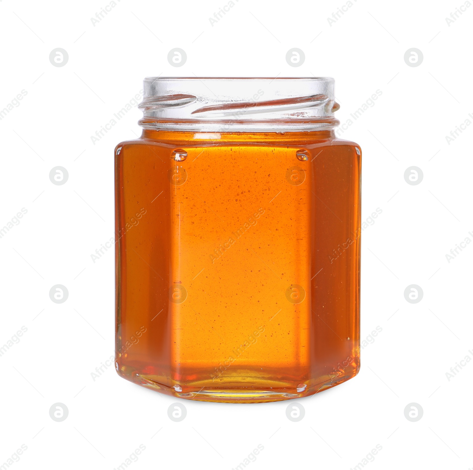 Photo of Tasty natural honey in glass jar isolated on white