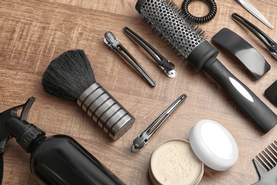 Professional hairdresser tools on wooden background