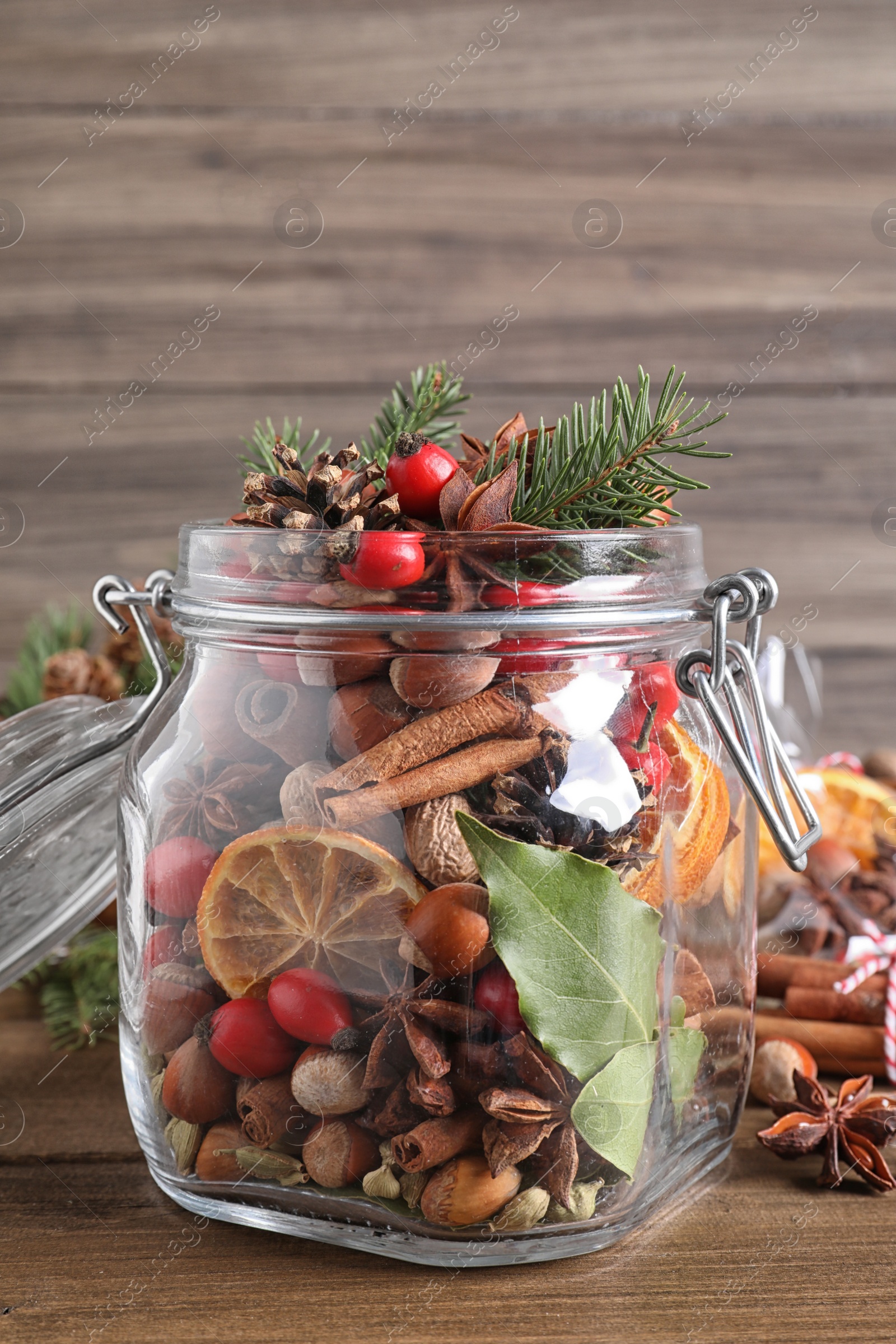 Photo of Aroma potpourri with different spices on wooden table