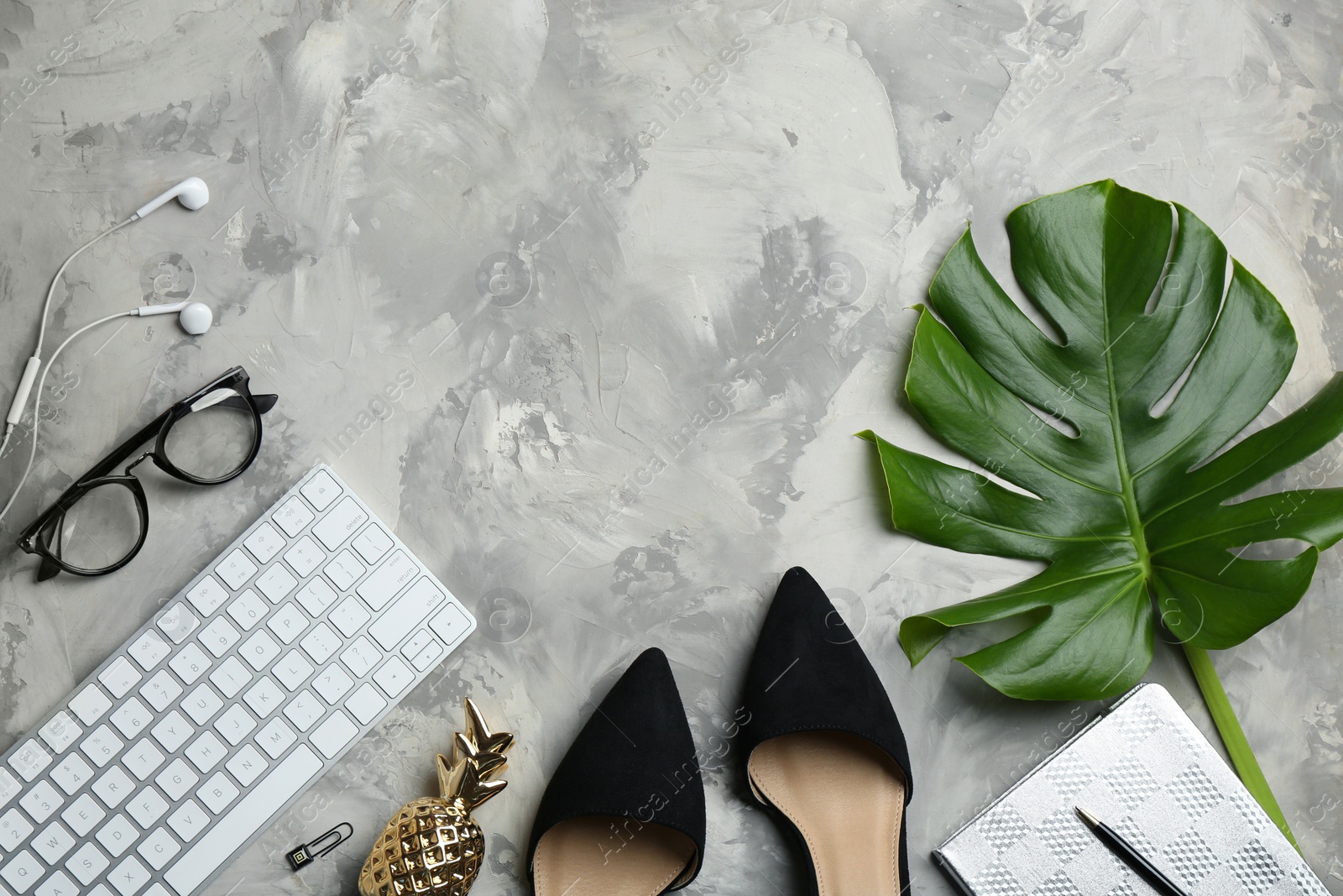 Photo of Flat lay composition with keyboard, shoes and space for text on grey background. Fashion blogger