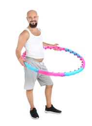 Photo of Overweight man with hula hoop on white background