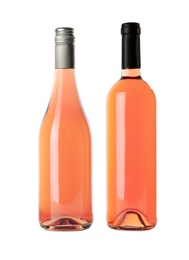 Photo of Bottles of delicious rose wine on white background. Mockup for design