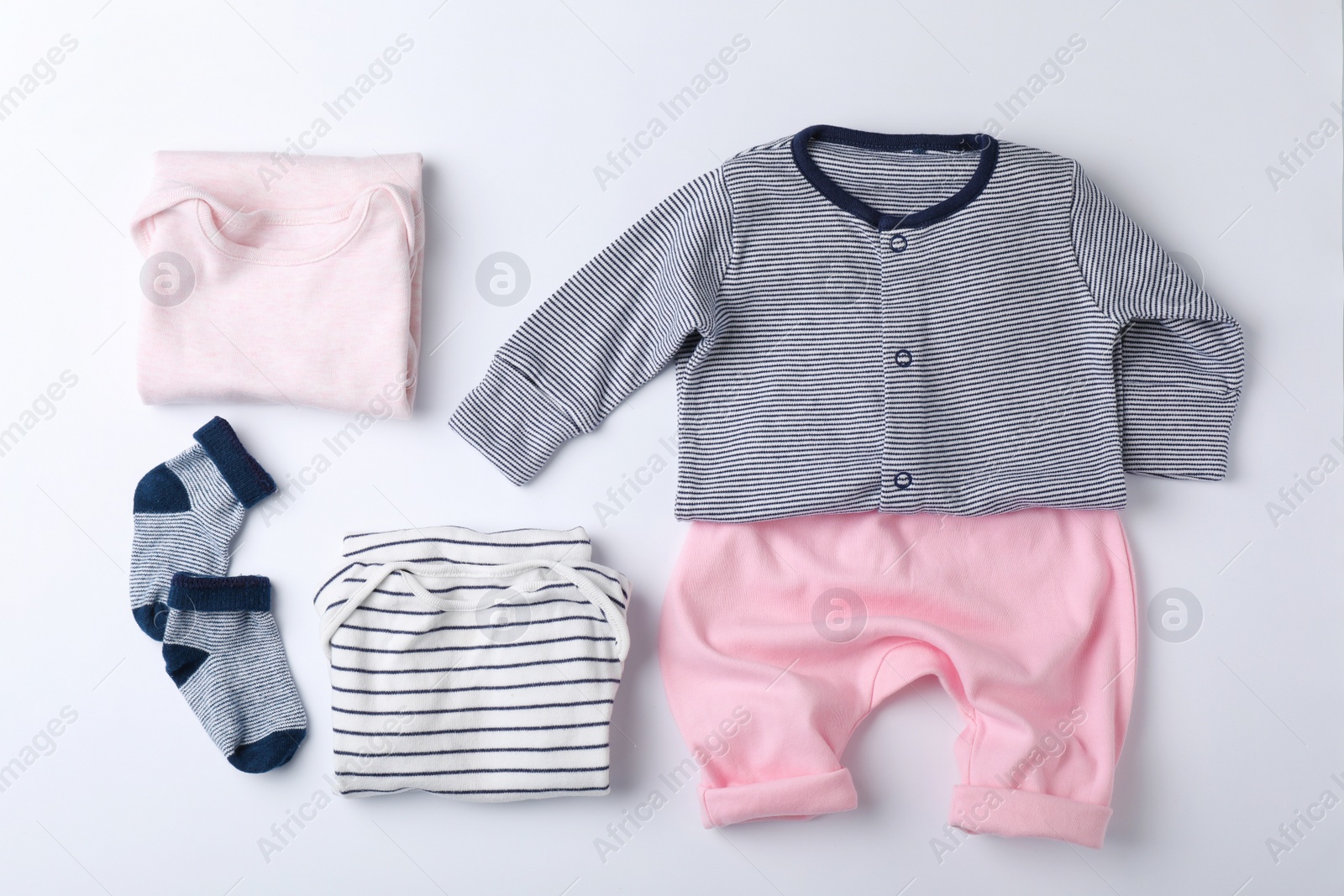 Photo of Flat lay composition with clothes for baby on white background