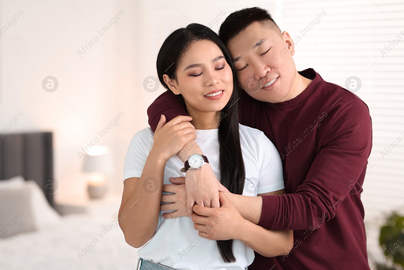 Photo of Portrait of lovely couple at home, space for text