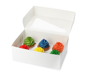 Photo of Box with delicious colorful cupcakes isolated on white