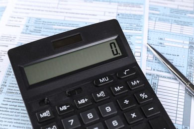 Tax accounting. Calculator, documents and pen, closeup