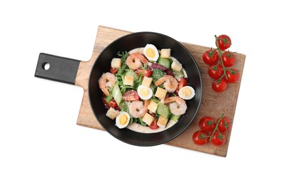 Delicious Caesar salad with shrimps and tomatoes on white tiled table, top view