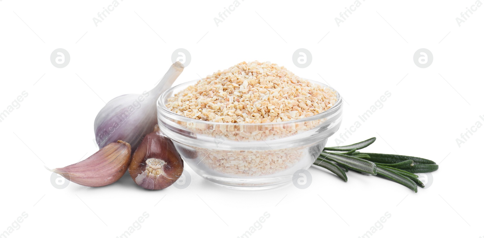 Photo of Dehydrated garlic granules in bowl, rosemary and unpeeled cloves isolated on white