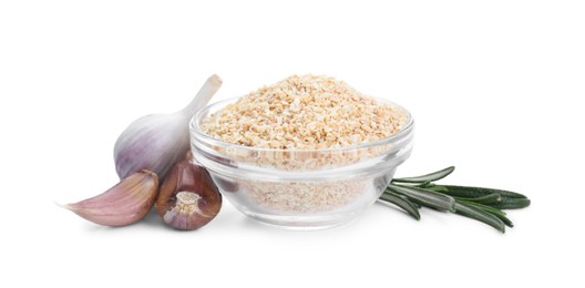 Dehydrated garlic granules in bowl, rosemary and unpeeled cloves isolated on white