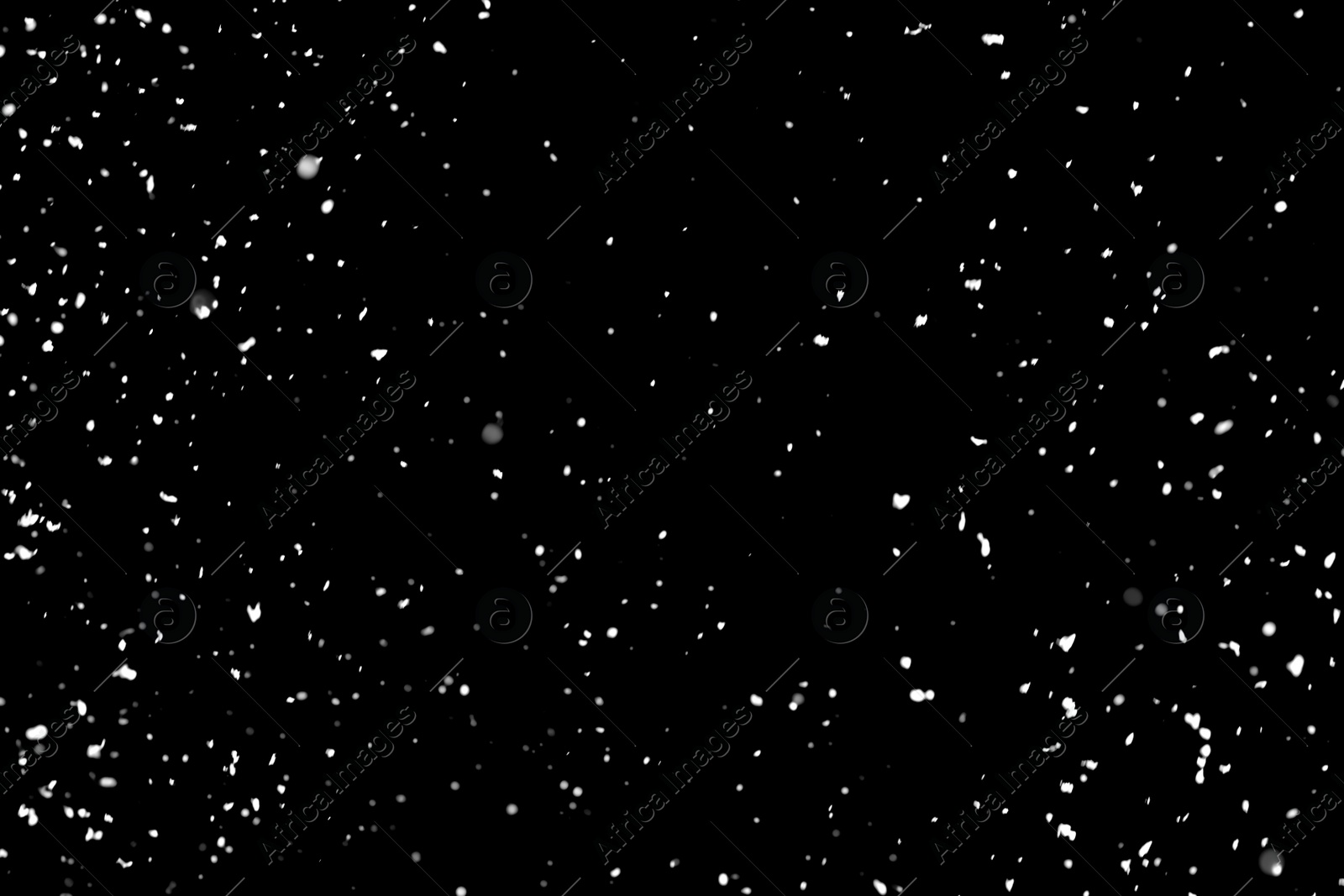 Photo of White snow falling down on black background