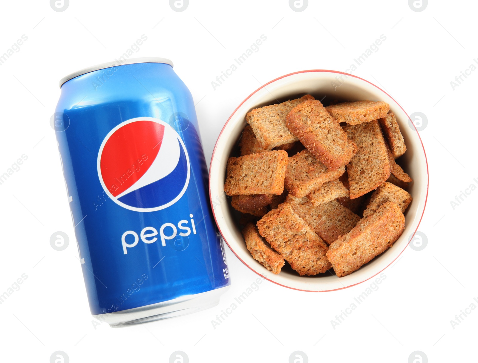 Photo of MYKOLAIV, UKRAINE - FEBRUARY 15, 2021: Can of Pepsi and snack on white background, top view