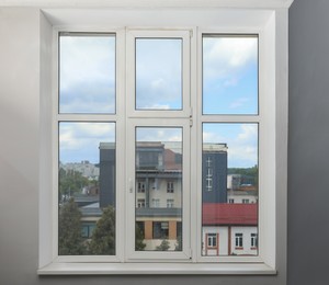 Beautiful window with white plastic frame indoors