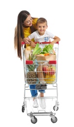 Photo of Mother and son with full shopping cart on white background