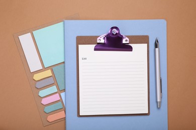 Photo of To do notes, stationery and planner on brown background, flat lay. Space for text