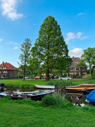 Photo of Beautiful city canal with moored boats on spring day