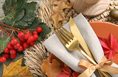 Festive table setting with autumn decor on wooden background, flat lay