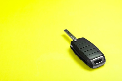 Photo of Car key on color background. Space for text