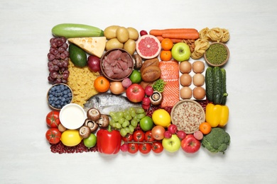 Different products on white table, top view. Healthy food and balanced diet