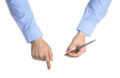 Man with pencil on white background, top view. Closeup of hands