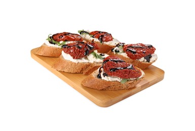 Delicious bruschettas with sun-dried tomatoes, cream cheese and balsamic vinegar isolated on white
