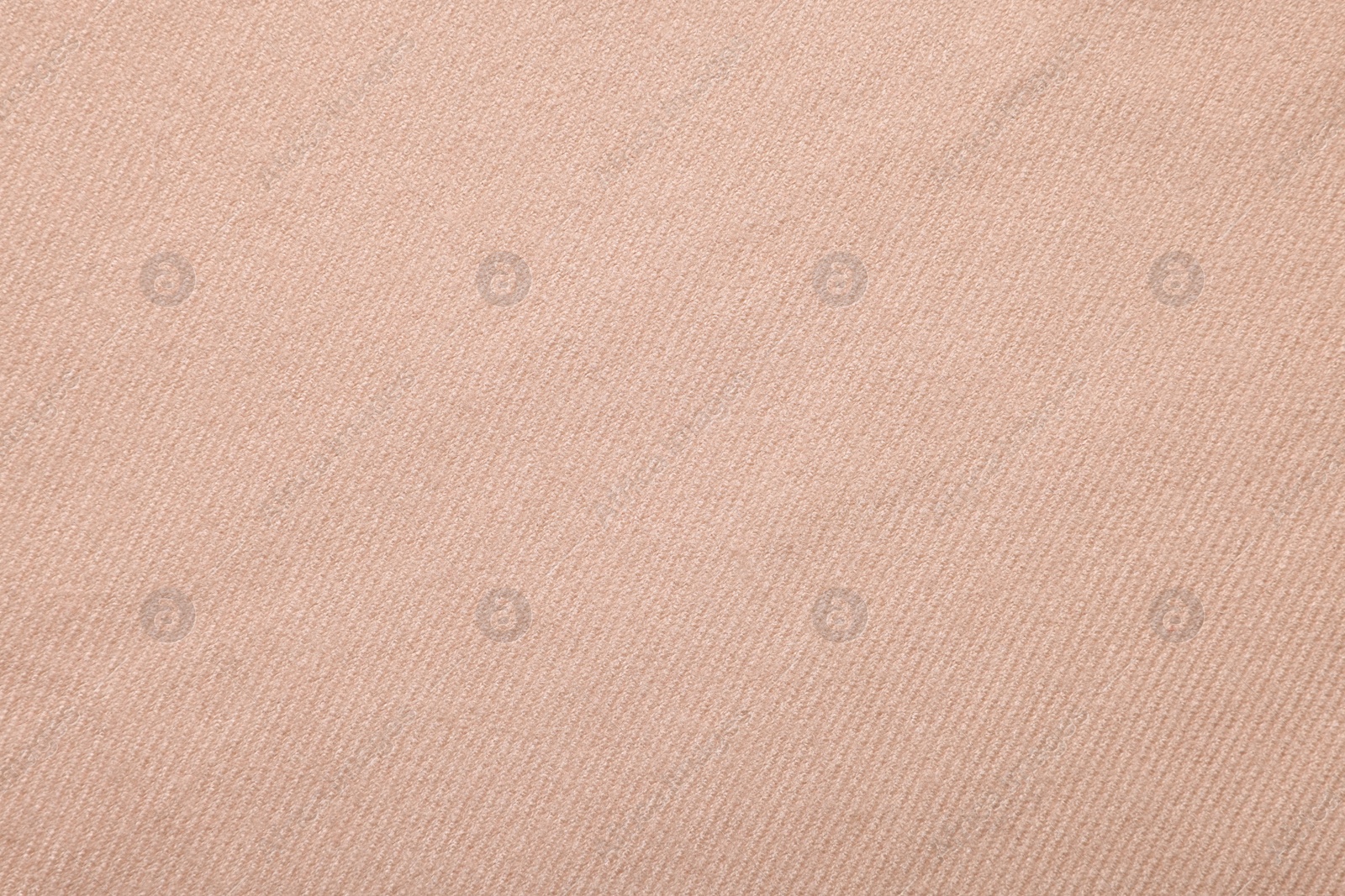 Photo of Texture of beige fabric as background, top view