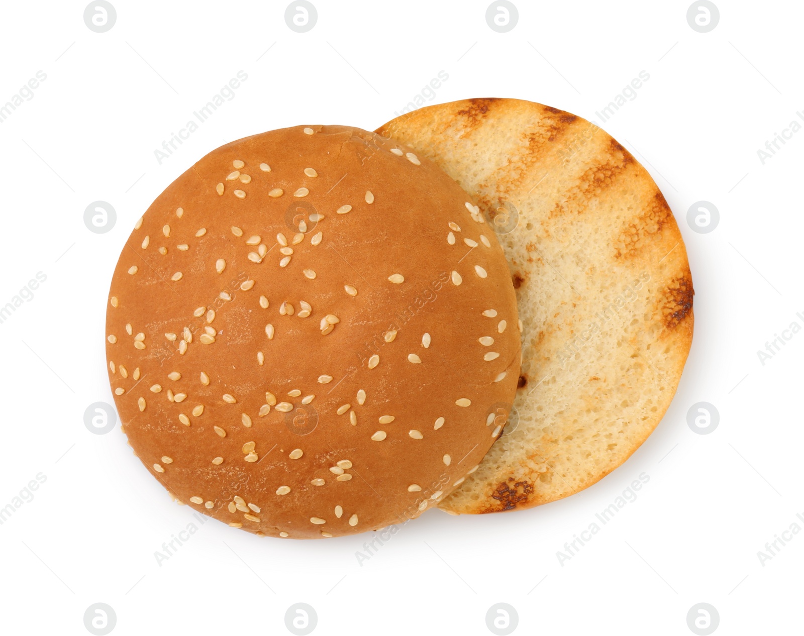 Photo of Halves of grilled burger bun isolated on white, top view