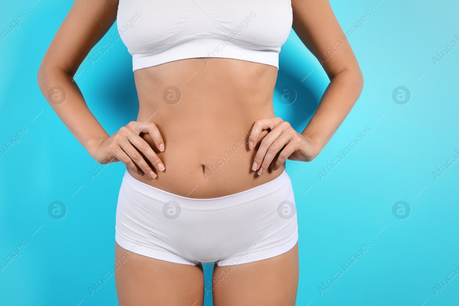 Photo of Slim woman in underwear on color background. Healthy diet