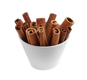 Photo of Cinnamon sticks in bowl isolated on white