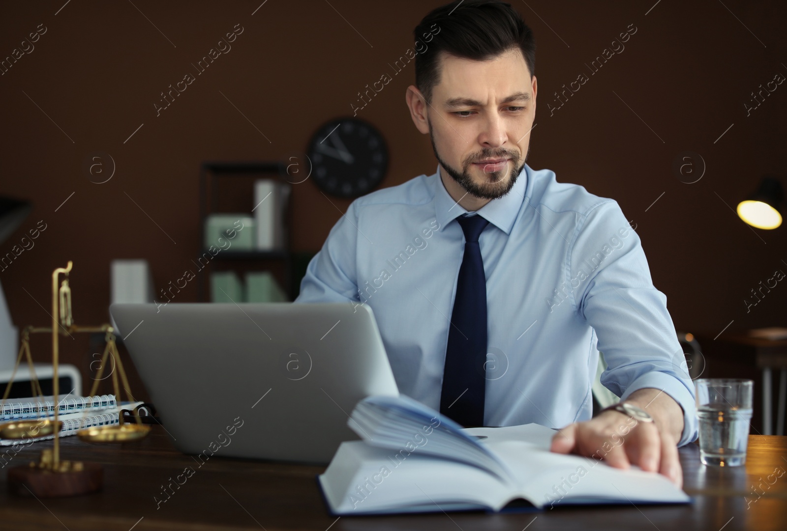 Photo of Male lawyer working in office