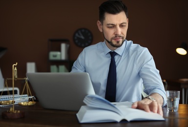 Male lawyer working in office