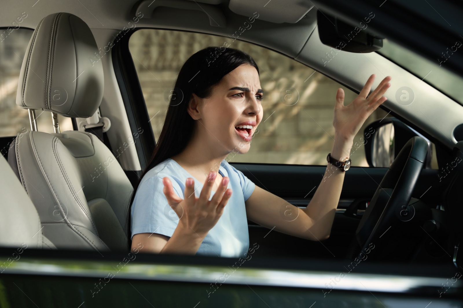 Photo of Stressed young woman driver's seat of modern car