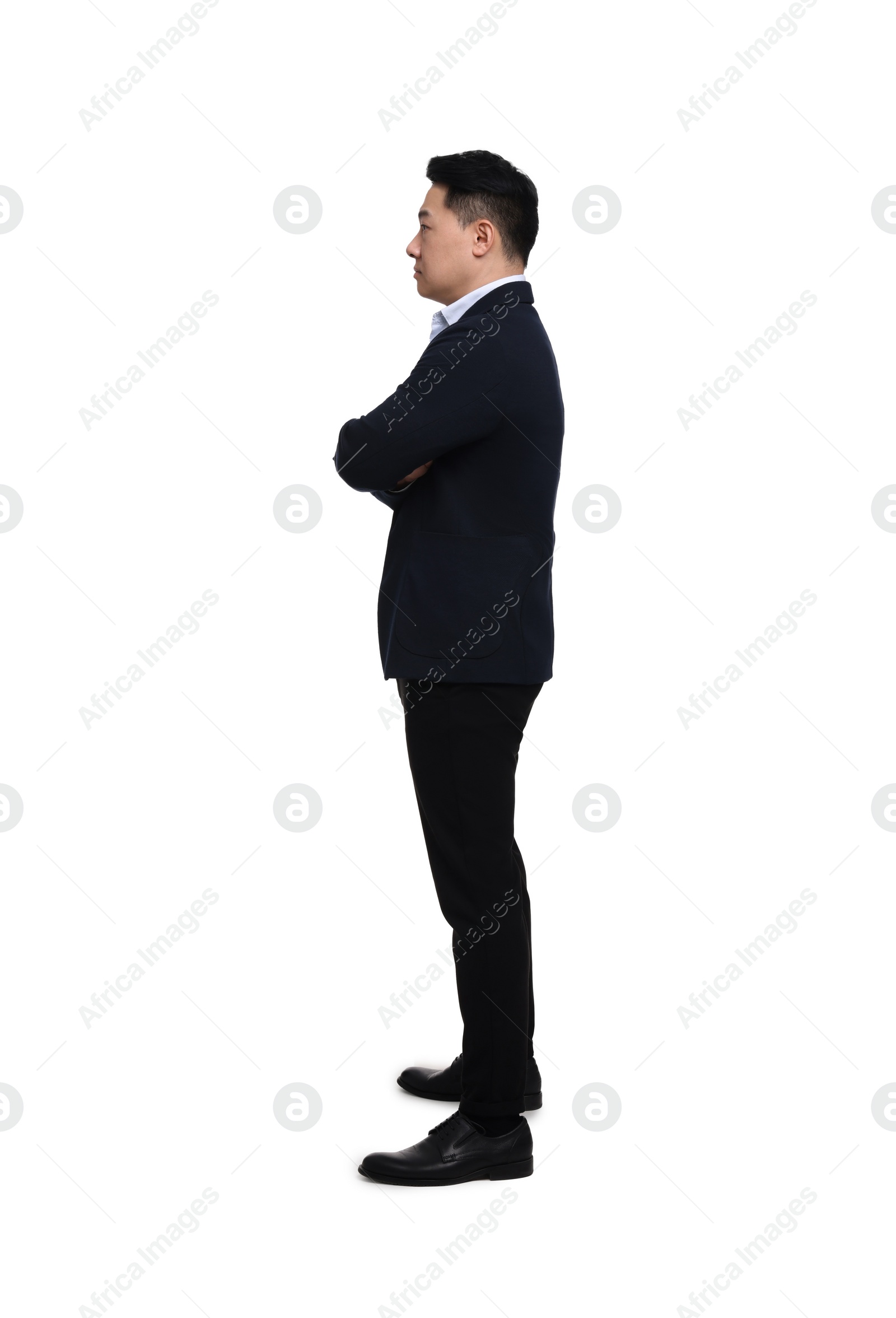 Photo of Businessman in suit posing on white background