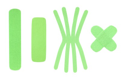Image of Set with green kinesio tapes on white background