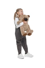 Cute girl with teddy bear on white background