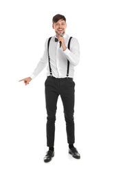 Photo of Handsome man in formal clothes singing with microphone on white background