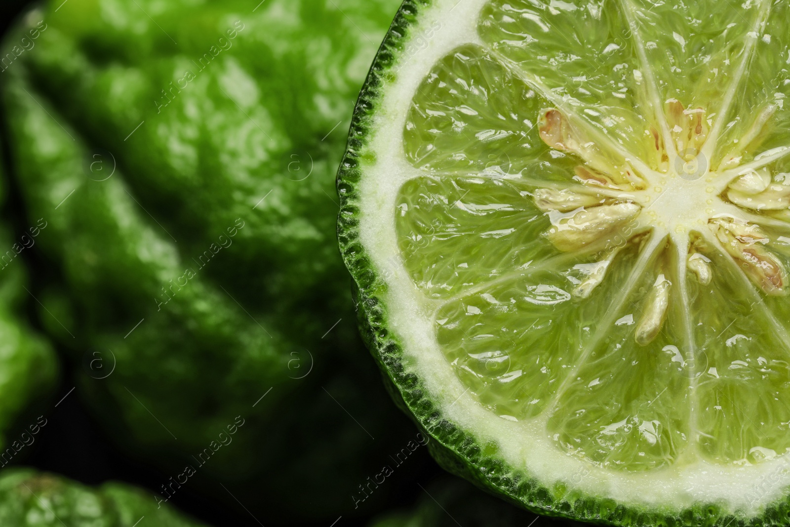 Photo of Whole and cut ripe bergamot fruits, closeup