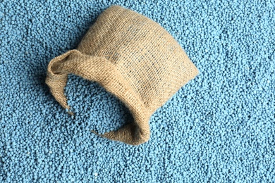 Photo of Sack bag and granular mineral fertilizer, top view