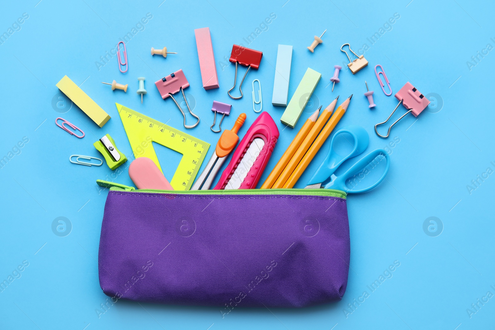 Photo of Back to school. Many different school stationery on light blue background, flat lay