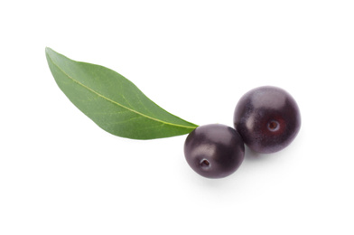 Photo of Fresh acai berries with leaf isolated on white, top view