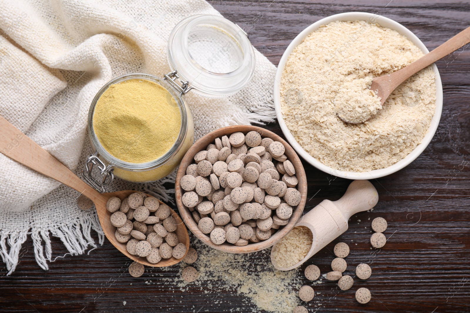 Photo of Flat lay composition with different types of brewer`s yeast on wooden table