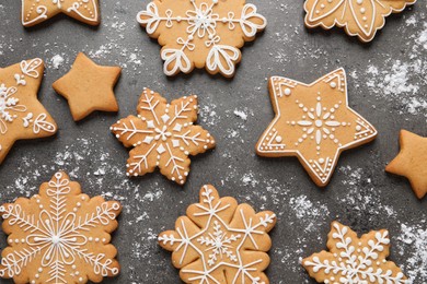 Photo of Tasty Christmas cookies on grey table, flat lay