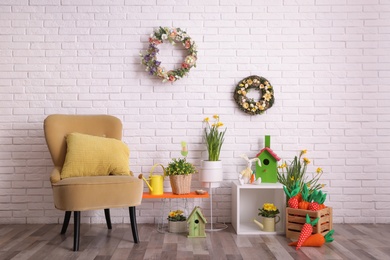 Elegant Easter photo zone with floral decor and armchair indoors